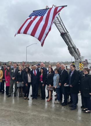 County and city officials standing on final phase of Clinton Keith Road